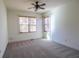 Well-lit bedroom with carpet flooring and two large windows at 2725 Monet Dr, Cumming, GA 30041