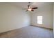 Empty bedroom with gray carpet and ceiling fan at 2725 Monet Dr, Cumming, GA 30041