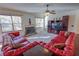 Living room with red leather sofas, fireplace and built-in entertainment center at 2725 Monet Dr, Cumming, GA 30041