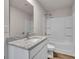 Bathroom with granite countertop and bathtub at 504 Overlook Rd, Covington, GA 30052