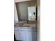 Bathroom vanity with granite countertop and gray cabinets at 504 Overlook Rd, Covington, GA 30052