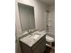 Bathroom with granite countertop, vanity, and shower at 504 Overlook Rd, Covington, GA 30052