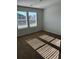 Bright bedroom with carpet flooring and two large windows at 504 Overlook Rd, Covington, GA 30052