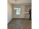 Dining room with chandelier and wood-look floors at 504 Overlook Rd, Covington, GA 30052