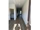 Bright entry hall with wood-look floors and views into the kitchen and living areas at 504 Overlook Rd, Covington, GA 30052