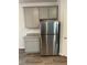 Kitchen with stainless steel refrigerator and gray cabinets at 504 Overlook Rd, Covington, GA 30052