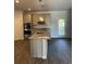 Modern kitchen with stainless steel appliances and granite countertops at 504 Overlook Rd, Covington, GA 30052