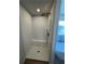 Walk-in shower with white subway tile and bench at 504 Overlook Rd, Covington, GA 30052