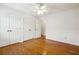 Bright bedroom with double doors and ample closet space at 135 Wilbanks Dr, Fayetteville, GA 30215