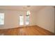 Bright dining room with hardwood floors and access to the backyard at 1873 Jameson Cir, Lawrenceville, GA 30043