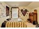 Bedroom with unique wall decor and wood dresser at 3431 Tioga Lake Cv, Lawrenceville, GA 30044