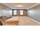 Upstairs bedroom with gray walls and neutral carpeting at 3431 Tioga Lake Cv, Lawrenceville, GA 30044