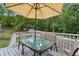 Back deck with patio furniture and an umbrella at 1250 Woodleigh Sw Rd, Marietta, GA 30008