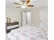 Bright bedroom with ceiling fan and ample closet space at 211 Streamside Dr, Roswell, GA 30076