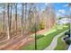 Landscaped grounds with a walking path and mature trees at 211 Streamside Dr, Roswell, GA 30076