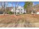 Two-story house with white exterior, gray accents, and a manicured lawn at 3920 Charlemagne Sw Way, Marietta, GA 30064