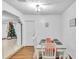 Dining area with white table and chairs near a Christmas tree at 3109 Meadow Wood Ct, Lawrenceville, GA 30044