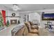 Living area with a large TV and comfortable seating at 3109 Meadow Wood Ct, Lawrenceville, GA 30044