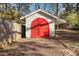 Well-maintained shed with red doors, ideal for extra storage at 710 Windsor Ter, Avondale Estates, GA 30002