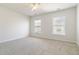 Spacious bedroom with grey carpet and ceiling fan at 7370 Gossamer St, Union City, GA 30291