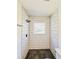 Modern bathroom with geometric tile shower and window at 2211 Macon Sw Dr, Atlanta, GA 30315