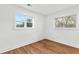 Simple bedroom with two windows and wood-look floors at 2211 Macon Sw Dr, Atlanta, GA 30315