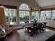 Sun-drenched dining room with hardwood floors and farmhouse table at 1025 Charleston Trce, Roswell, GA 30075