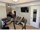 Home gym with treadmill and exercise bike at 1025 Charleston Trce, Roswell, GA 30075