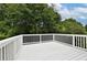 White deck overlooking a wooded backyard at 1139 Mainstreet Valley Dr, Stone Mountain, GA 30088