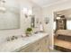 Elegant bathroom with marble vanity and a view of bedroom at 20 Pointe Se Ter, Atlanta, GA 30339