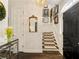 Bright entryway with staircase, mirror, and gallery wall at 20 Pointe Se Ter, Atlanta, GA 30339