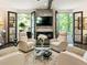 Gathering room with fireplace, French doors, and comfy seating at 20 Pointe Se Ter, Atlanta, GA 30339