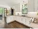 Modern kitchen with white cabinets, granite countertops, and stainless steel appliances at 20 Pointe Se Ter, Atlanta, GA 30339