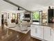 Open floor plan with kitchen and living area featuring comfortable seating and a fireplace at 20 Pointe Se Ter, Atlanta, GA 30339