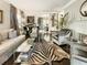 Spacious living room with fireplace, zebra rug, and piano at 20 Pointe Se Ter, Atlanta, GA 30339