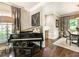 Living area with a piano and view into dining room at 20 Pointe Se Ter, Atlanta, GA 30339