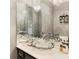 Elegant powder room features a crystal sink and marble vanity at 20 Pointe Se Ter, Atlanta, GA 30339