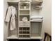 Well-organized walk-in closet with built-in shelves and hanging rods at 20 Pointe Se Ter, Atlanta, GA 30339