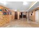 Basement with bar, wood paneling, and painted brick accent wall at 2574 Regal Cir, Lawrenceville, GA 30044