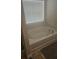 Relaxing bathroom with soaking tub, double vanity, and tile flooring at 2013 Chesley Dr, Austell, GA 30106