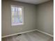 Bedroom with window overlooking wooded area at 5880 Yardley Ct, Powder Springs, GA 30127