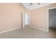 Well-lit bedroom with carpet flooring and ample closet space at 6422 Phillips Ct, Lithonia, GA 30058