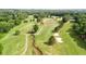 Golf course with sand traps, trees, and a small stream at 6705 Brookline Ct, Cumming, GA 30040