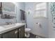 Clean bathroom with dark vanity and a shower/tub combo at 4663 Brazil Wood Nw Dr, Kennesaw, GA 30144