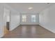 Main bedroom with wood-look floors and ensuite bath at 25 Lena Ct, Covington, GA 30016