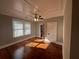 Hardwood floor bedroom with ceiling fan and window blinds at 31 N Broad N St, Porterdale, GA 30014