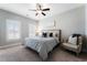 Bedroom with sitting area and ceiling fan at 1834 Grand Oaks Ln, Woodstock, GA 30188