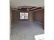 Main bedroom with carpeting and large window at 922 Melrose Woods Se Ct, Lawrenceville, GA 30045