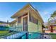 Side view of light green house with ramp and fence at 1286 Metropolitan Sw Pkwy, Atlanta, GA 30310