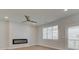 Bright living room with fireplace, hardwood floors, and access to deck at 3304 Cranston Ln, Kennesaw, GA 30144